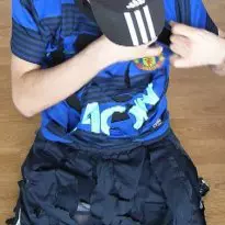 Man United shirt and Adidas trackies sliced up